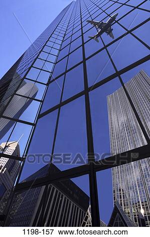 Stock Photo - reflection, airplane, glass, building, buildings, mirror, reflecting. Fotosearch
