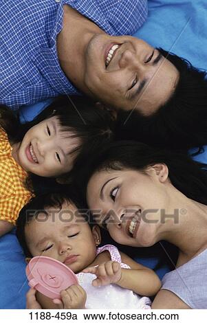 relaxed, overhead, people, smiling, Asian, outdoors, relaxing View Large Photo Image Stock Image - relaxed, overhead, people, smiling, Asian, outdoors, relaxing. Fotosearch