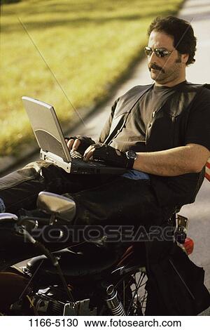 relaxed, people, computer, laptop, typing, motorcycle View Large Photo Image Stock Image - relaxed, people, computer, laptop, typing, motorcycle. Fotosearch