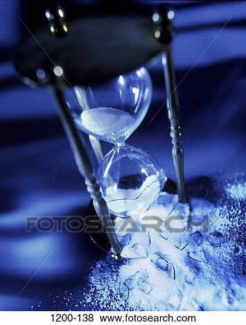 Stock Photo - sand, glass, hourglass, time, blue, broken, future. Fotosearch