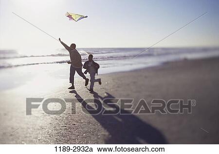 sand, people, running, flying, beach, silhouette, family View Large Photo Image Stock Image - sand, people, running, flying, beach, silhouette, family. Fotosearch