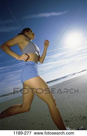 sand, people, water, running, woman, sun, shining View Large Photo Image Stock Photo - sand, people, water, running, woman, sun, shining. Fotosearch