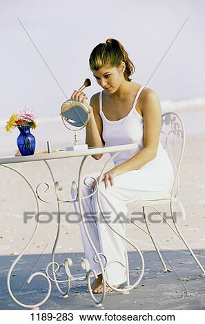 sand, people, woman, table, chair, beach, brushing View Large Photo Image Stock Image - sand, people, woman, table, chair, beach, brushing. Fotosearch