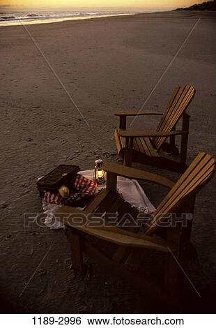 Stock Photograph - sand, relaxation, water, empty, dusk, picnic, evening. Fotosearch