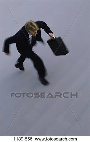 Stock Photograph - steps, stairs, briefcase, rush, business, outdoors. Fotosearch