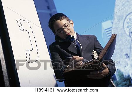 Stock Image - telephone, talking, listening, conversation, pay phone, phone, notebook. Fotosearch