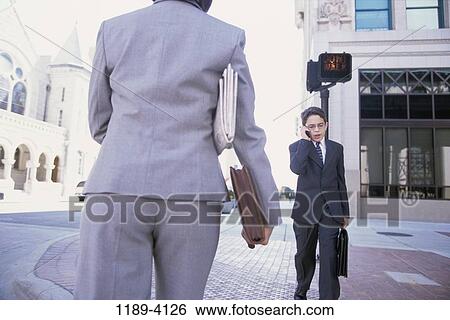 telephone, walking, suit, talking, conversation, phone, boy View Large Photo Image Stock Photograph - telephone, walking, suit, talking, conversation, phone, boy. Fotosearch