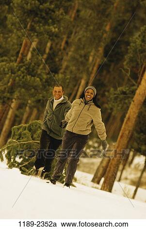 tree, multiethnic, people, snow, smiling, couple, winter View Large Photo Image Stock Image - tree, multiethnic, people, snow, smiling, couple, winter. Fotosearch