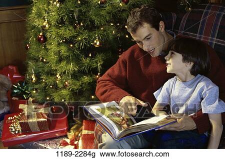 tree, people, smiling, listening, reading, Christmas View Large Photo Image Stock Image - tree, people, smiling, listening, reading, Christmas. Fotosearch