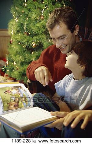 tree, people, smiling, reading, Christmas, book, smile View Large Photo Image Stock Image - tree, people, smiling, reading, Christmas, book, smile. Fotosearch