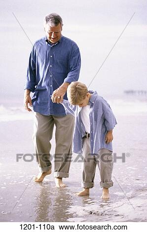 Stock Image - wading, hands, water, walking, beach, holding, family. Fotosearch