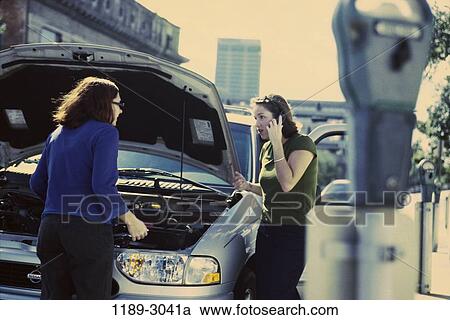 women, people, talking, car, phone, outdoors, parking View Large Photo Image Stock Image - women, people, talking, car, phone, outdoors, parking. Fotosearch