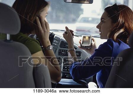 women, people, talking, car, phone, driving, outdoors View Large Photo Image Stock Image - women, people, talking, car, phone, driving, outdoors. Fotosearch