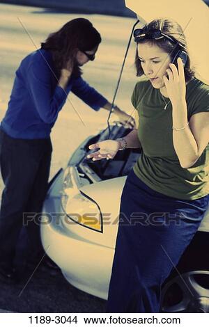 women, people, telephone, car, phone, outdoors, transportation View Large Photo Image Picture - women, people, telephone, car, phone, outdoors, transportation. Fotosearch