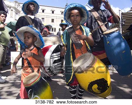 Stock Image - Boys playing drums in a traditional festival, Montevideo, Uruguay. Fotosearch