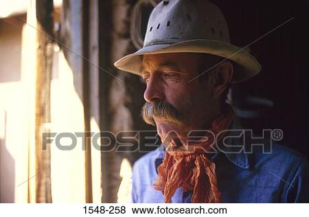 Close-up of a cowboy thinking View Large Photo Image Stock Photo - Close-up of a cowboy thinking. Fotosearch