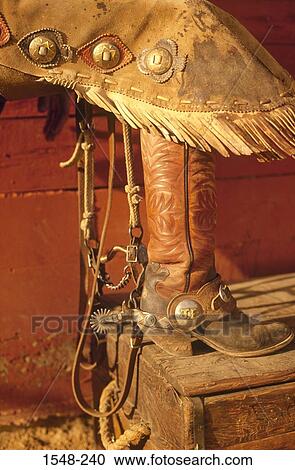 Close-up of a cowboy's leg with boot and chaps on a bench View Large Photo Image Stock Image - Close-up of a cowboy's leg with boot and chaps on a bench. Fotosearch