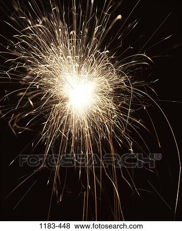 Close-up of a fireworks display at night View Large Photo Image Stock Photo - Close-up of a fireworks display at night. Fotosearch