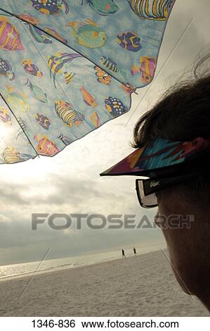 Close-up of a woman on the beach View Large Photo Image Stock Photograph - Close-up of a woman on the beach. Fotosearch