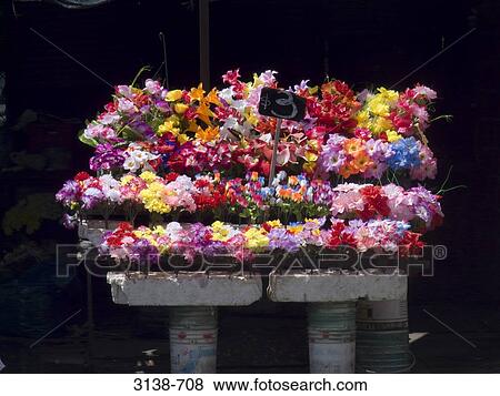 Close-up of artificial flowers at a market stall View Large Photo Image Stock Photo - Close-up of artificial flowers at a market stall. Fotosearch