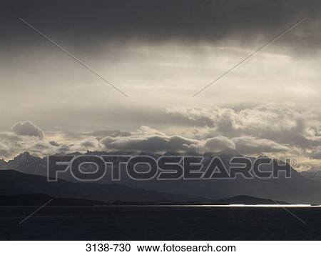 Clouds over mountains, Beagle Channel, Tierra del Fuego, Argentina View Large Photo Image Stock Image - Clouds over mountains, Beagle Channel, Tierra del Fuego, Argentina. Fotosearch