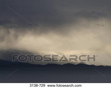 Clouds over mountains, Beagle Channel, Tierra del Fuego, Argentina View Large Photo Image Stock Photo - Clouds over mountains, Beagle Channel, Tierra del Fuego, Argentina. Fotosearch