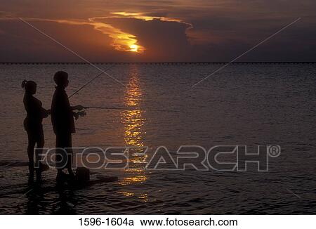 Couple fishing, Lake Pontchartrain, Bayou Sauvage National Wildlife Refuge, Louisiana, USA View Large Photo Image Stock Image - Couple fishing, Lake Pontchartrain, Bayou Sauvage National Wildlife Refuge, Louisiana, USA. Fotosearch