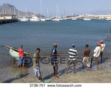 Fishermen pulling out net from the sea, Sao Vicente Island, Mindelo, Cape Verde View Large Photo Image Stock Image - Fishermen pulling out net from the sea, Sao Vicente Island, Mindelo, Cape Verde. Fotosearch