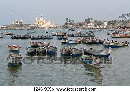 Fishing boats in the sea with a mosque in the background, Vishinjam, Thiruvananthapuram, Kerala, India View Large Photo Image Stock Image - Fishing boats in the sea with a mosque in the background, Vishinjam, Thiruvananthapuram, Kerala, India. Fotosearch