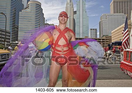 Gay man in female clothing participating in a gay pride parade, Minneapolis, Minnesota, USA View Large Photo Image Stock Photography - Gay man in female clothing participating in a gay pride parade, Minneapolis, Minnesota, USA. Fotosearch