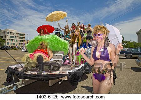Group of people participating in a gay pride parade, Minneapolis, Minnesota, USA View Large Photo Image Stock Image - Group of people participating in a gay pride parade, Minneapolis, Minnesota, USA. Fotosearch