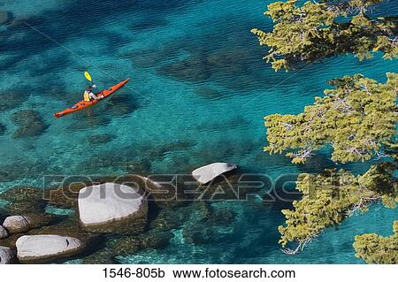 High angle view of a man kayaking in a lake, Lake Tahoe, Nevada, USA View Large Photo Image Stock Image - High angle view of a man kayaking in a lake, Lake Tahoe, Nevada, USA. Fotosearch