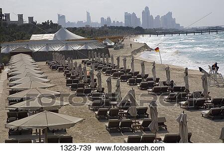 High Angle View Of Lounge Chairs And Beach Umbrellas At A Tourist