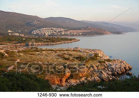 Stock Image - High angle view of the sea with a mountain range in the background, Novi Vinodolski, Croatia. Fotosearch