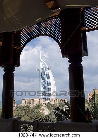 Hotel viewed through an arch, Burj Al Arab Hotel, Dubai, United Arab Emirates View Large Photo Image Stock Photo - Hotel viewed through an arch, Burj Al Arab Hotel, Dubai, United Arab Emirates. Fotosearch