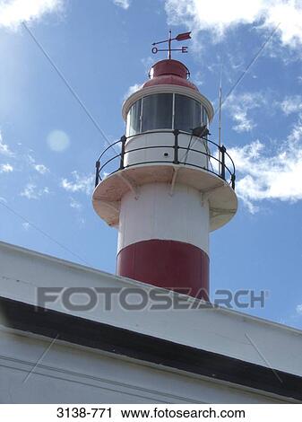 Stock Image - Low angle view of a lighthouse, Magdalena Island, Magellan, Punta Arenas, Patagonia, Chile. Fotosearch