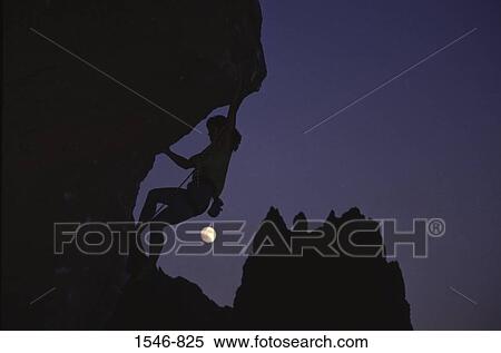 Low angle view of a mountaineer hiking at night View Large Photo Image Stock Photography - Low angle view of a mountaineer hiking at night. Fotosearch