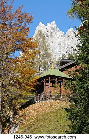 Stock Photograph - Low angle view of a pavilion with a mountain in the background, Monte Antelao, San Vito di Cadore, Veneto, Italy. Fotosearch