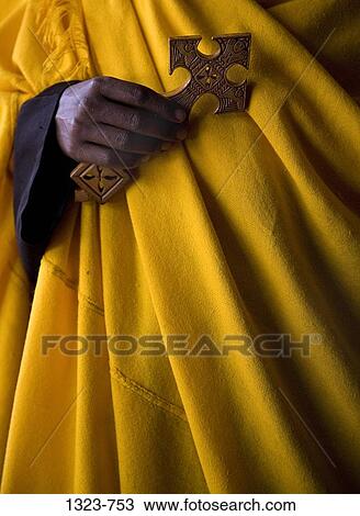 Mid section view of a priest holding a cross, Ethiopia View Large Photo Image Stock Image - Mid section view of a priest holding a cross, Ethiopia. Fotosearch