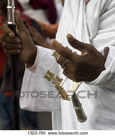 Mid section view of a priest holding a sistrom, Timkat Festival, Addis Ababa, Ethiopia View Large Photo Image Stock Photography - Mid section view of a priest holding a sistrom, Timkat Festival, Addis Ababa, Ethiopia. Fotosearch