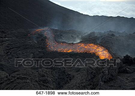 Molten lava flowing from a volcanic mountain, Pacaya Volcano, Guatemala View Large Photo Image Stock Photo - Molten lava flowing from a volcanic mountain, Pacaya Volcano, Guatemala. Fotosearch