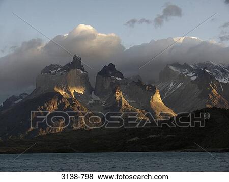 Stock Photo - Mountains at the lakeside, Cuernos del Paine, Lake Pehoe, Torres del Paine National Park, Patagonia, Chile. Fotosearch