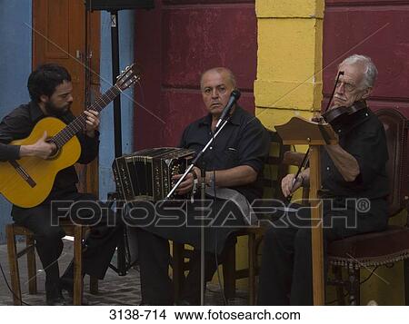 Picture - Musical band performing in a recording studio, Buenos Aires, Argentina. Fotosearch