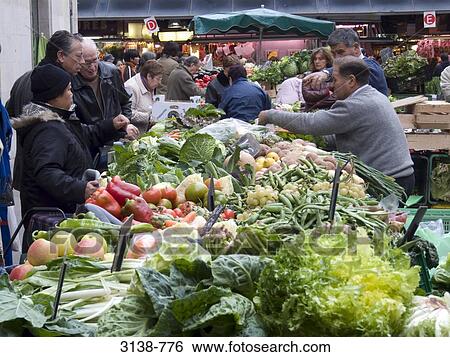 People buying fruits and vegetables in a market, Barcelona, Catalonia, Spain View Large Photo Image Stock Photograph - People buying fruits and vegetables in a market, Barcelona, Catalonia, Spain. Fotosearch