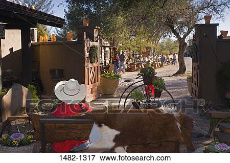 Person sitting on a bench in a market, Tubac, Arizona, USA View Large Photo Image Stock Photo - Person sitting on a bench in a market, Tubac, Arizona, USA. Fotosearch