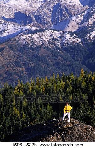 Person standing on a rock, Stuart Range, Red Top Lookout, Wenatchee National Forest, Washington State, USA View Large Photo Image Stock Image - Person standing on a rock, Stuart Range, Red Top Lookout, Wenatchee National Forest, Washington State, USA. Fotosearch