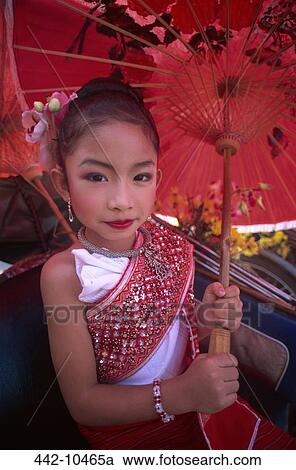 Portrait of a girl in traditional Thai costume holding a parasol at a traditional festival, Chiang Mai Flower Festival, Chiang Mai, Chiang Mai Province, Thailand View Large Photo Image Stock Image - Portrait of a girl in traditional Thai costume holding a parasol at a traditional festival, Chiang Mai Flower Festival, Chiang Mai, Chiang Mai Province, Thailand. Fotosearch