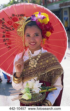 Portrait of a young woman in a traditional Thai costume at a traditional festival, Chiang Mai Flower Festival, Chiang Mai, Chiang Mai Province, Thailand View Large Photo Image Stock Photo - Portrait of a young woman in a traditional Thai costume at a traditional festival, Chiang Mai Flower Festival, Chiang Mai, Chiang Mai Province, Thailand. Fotosearch