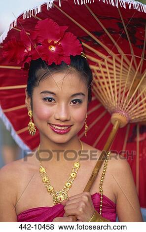 Portrait of a young woman in traditional Thai costume at a traditional festival, Chiang Mai Flower Festival, Chiang Mai, Chiang Mai Province, Thailand View Large Photo Image Stock Photo - Portrait of a young woman in traditional Thai costume at a traditional festival, Chiang Mai Flower Festival, Chiang Mai, Chiang Mai Province, Thailand. Fotosearch