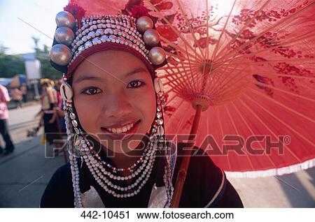 Portrait of an Akha tribal woman holding a parasol and smiling, Chiang Rai, Chiang Rai Province, Thailand View Large Photo Image Stock Image - Portrait of an Akha tribal woman holding a parasol and smiling, Chiang Rai, Chiang Rai Province, Thailand. Fotosearch
